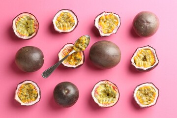 Fresh passion fruits and spoon on pink background, flat lay