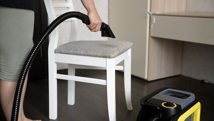 Housewife cleaning chair with vacuum cleaner