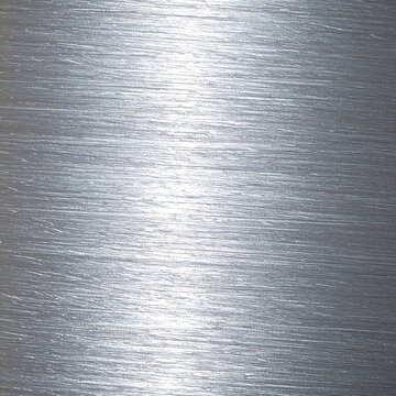 Close-up of a smooth, metallic silver thread or fabric