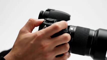 Capturing moments: hands adjusting camera lens for perfect photography shot