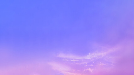 Beautiful colored clear sky and small fluffy clouds in dawn or twilight time. Colorful background from outdoor natural sunset with 16:9 copy space.