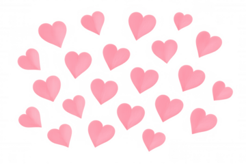 Delicate pink paper hearts drifting against transparent surface, symbolizing love and celebration