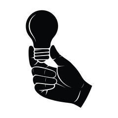Silhouette of a hand holding a glowing light bulb representing a new idea or inspiration