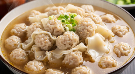 A bowl of wontons with a soup