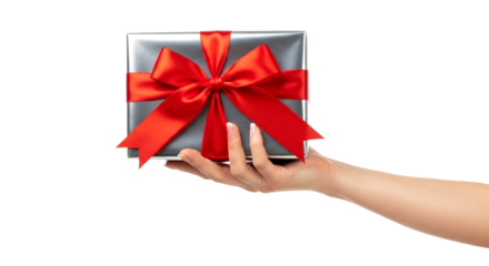 a hand offering a silver gift box with a red bow celebrating festive moments, joyful surprises, and precious gifts, isolated on transparent background