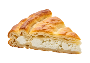 A close-up view of a golden-brown, flaky pastry slice filled with white, crumbly cheese.