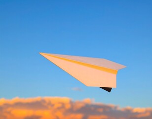 Paper airplane soars through a vibrant sunset sky