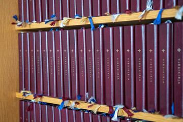 Stack of books with church hymns and verses. Symbol of Christian tradition, devotion, spiritual...