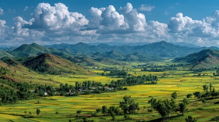 Obraz premium North Korean countryside landscape with wide fields rolling hills and small villages under dramatic cloudy sky travel concept