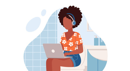 Young African American woman multitasks by working on her laptop with headphones while sitting on the toilet, depicting modern work-from-home lifestyle and flexibility.