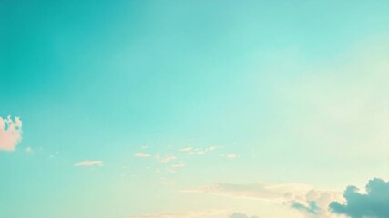 A couple enjoying a sunny day on the beach, flying a kite in the clear blue sky
