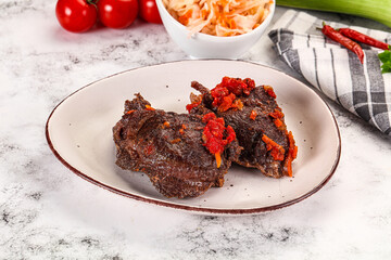 Baked beef cheeks with vegetables