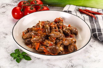 Baked chicken hearts with vegetables