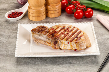 Grilled pork loin steak with bone