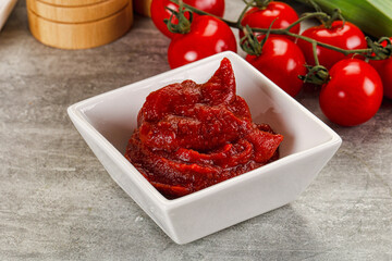 Red tomato paste in the bowl