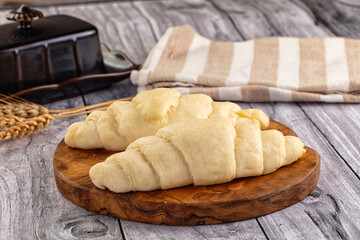 Raw uncooked croissant for bake