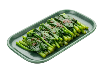 A vibrant display of sauteed spinach greens, glistening with a savory sauce and aromatic spices, arranged attractively on a textured, dark green platter.