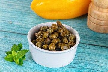 Pickled canned capers in the bowl