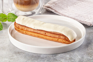 White vanilla eclair with icing