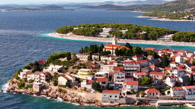 Croatian Coastal Iconic Peninsula with Lush Greenery, Inviting Beaches, History, Nature.Stunning aerial view of Primosten peninsula with turquoise waters and traditional Mediterranean architecture
