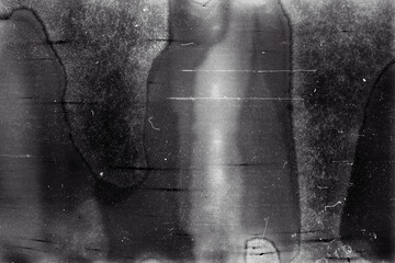 Blank grained film strip texture background with heavy grain, dust and light leak. Old expired...