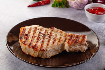 Tasty hot grilled bone steak served sauce