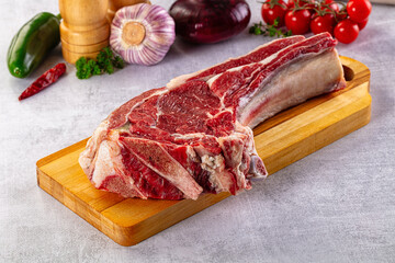 Raw prime beef steak with bone