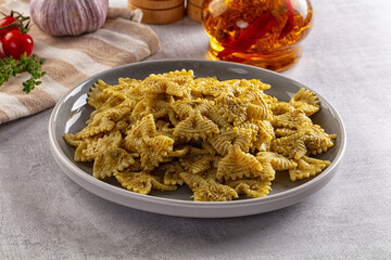 Italian green pasta farfalle with pesto