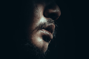 Obraz premium Close-Up of Man's Face in Low Light