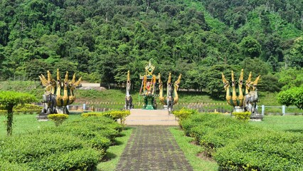 Statues of various animals in the grassland