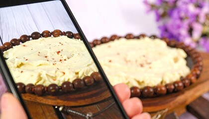 Closeup of Creamy Mashed Potatoes with Red Pepper Flakes on Wooden Board