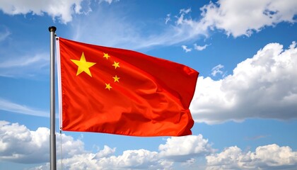Naklejka premium Chinese national flag waving brightly against a clear sky with scattered clouds