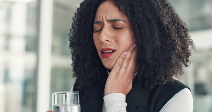 Business woman, pain and stress with toothache in office for strain, pressure or mouth infection. Frustrated, female person or sore jaw with water for dental injury, gingivitis or cavity in workplace