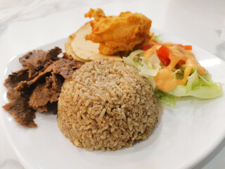 Delicious middle eastern platter. A flavorful fusion of doner, rice and fresh salad.