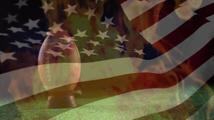 Animation of waving usa flag and flames over american football ball - Powered by Adobe