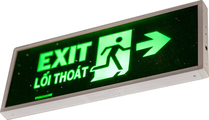 Illuminated exit sign with arrow directing to safety.