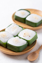 Traditional Thai dessert (Khanom Tako), Pudding with coconut cream topping in pandan leaf