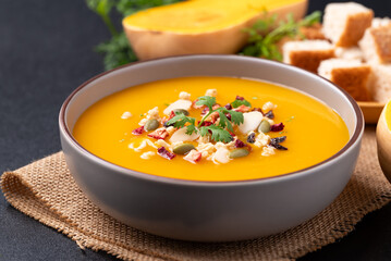 Butternut squash pumpkin soup in a bowl, Homemade food in autumn season
