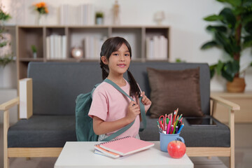 Child smiling with backpack ready for school
