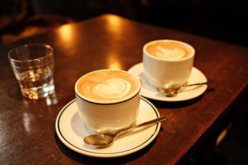 two cups of coffee on a table