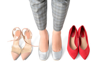 Woman with different shoes isolated on white background