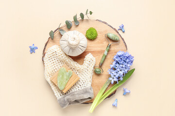 Composition with spa accessories and beautiful hyacinth flower on color background