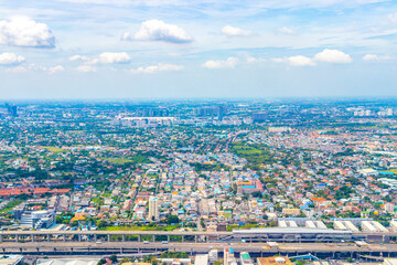 Fototapeta premium Flight over Bangkok Thailand city panorama view from airplane cityscape.