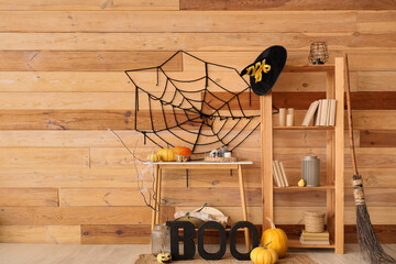 Shelving unit and table with Halloween decor in living room