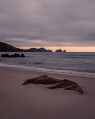 Cape Vilan Lighthouse and Reira beach in Camari&ntilde;as, Galicia, Spain. First electrical lighthouse in Spain. This lighthouse was the first electrical lighthouse in Spain.