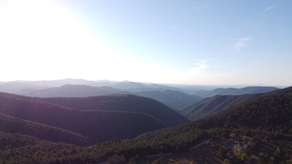 Aerial view of a beautiful valley in the mountains at sunset.