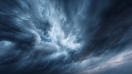 Dramatic stormy sky with swirling dark clouds creating a powerful and ominous weather scene hinting at impending rain or thunder