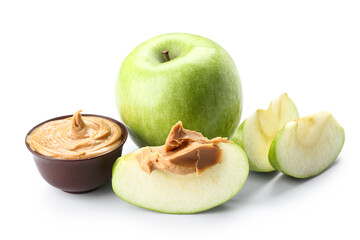 Fresh apples and bowl of sweet peanut butter on white background