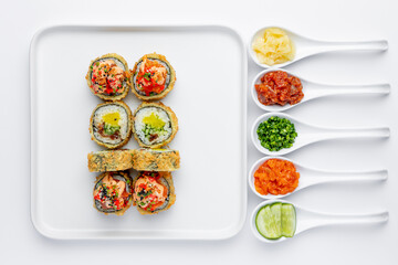 Baked sushi roll with salmon, tuna, shrimp, avocado and cream cheese