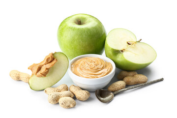 Fresh apples, nuts and bowl of sweet peanut butter on white background